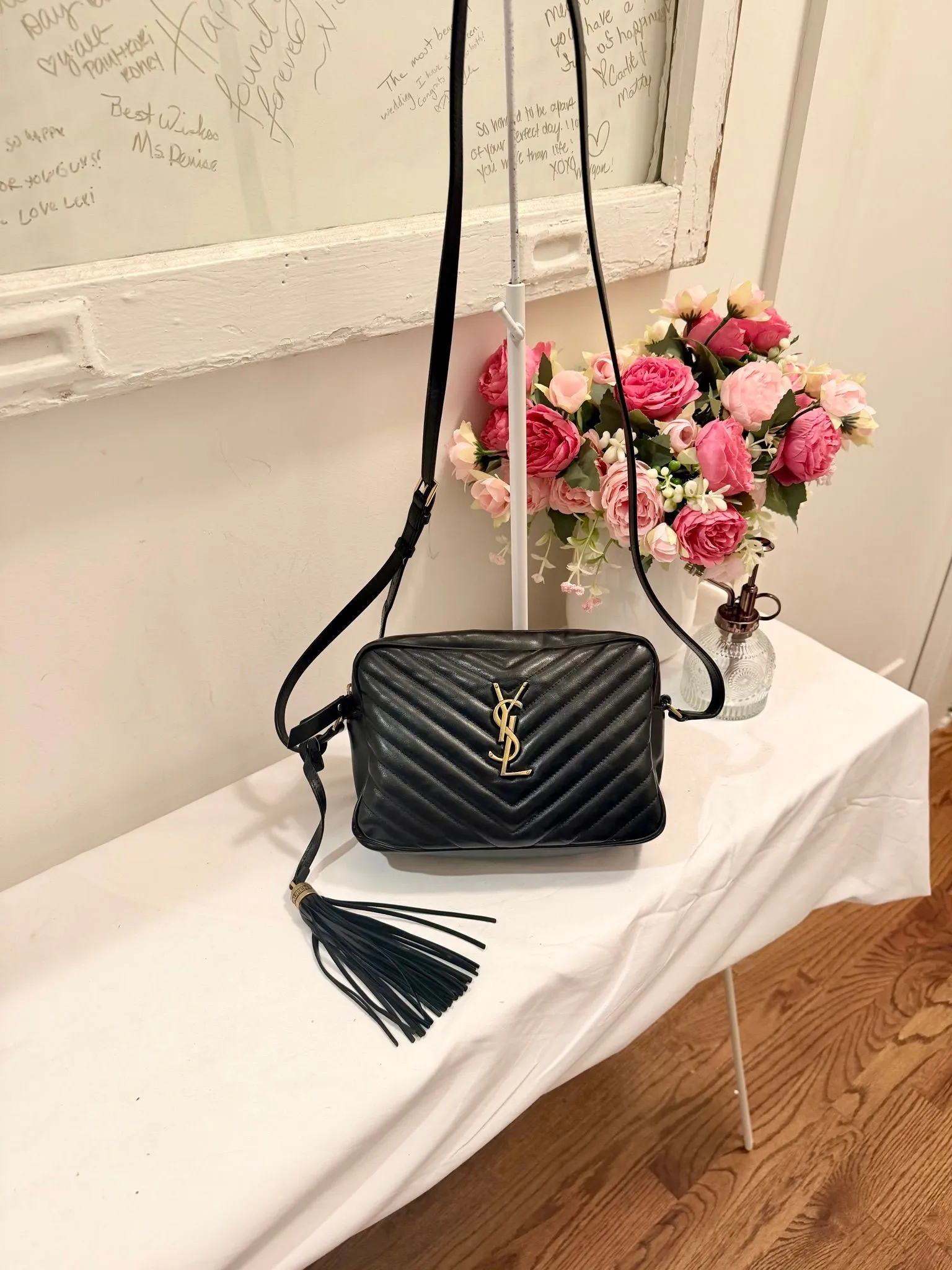 Authenticated Black YSL Saint Laurent Lou Camera Bag Crossbody with Tassel — pre-owned luxury designer Saint Laurent bag | LaceLuxx