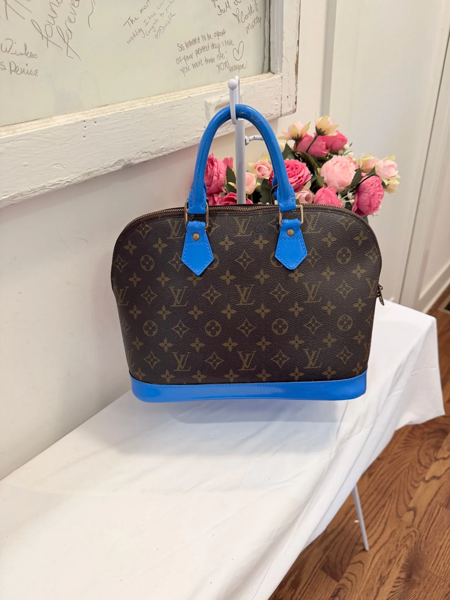 Authenticated Louis Vuitton Monogram Alma with Painted Blue Trim — pre-owned luxury designer Louis Vuitton bag | LaceLuxx